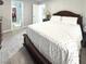 Main bedroom featuring a bed with patterned bedding, and access to closet and bathroom at , Las Vegas, NV 89183