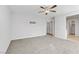 A spacious carpeted bedroom with ample room and a view of the closet and bathroom at 10785 Wild Parsley Ave, Las Vegas, NV 89129