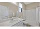 Bright bathroom with single sink vanity, tub-shower combo, and neutral color palette at 1091 E Sunset Rd, Henderson, NV 89011