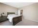 A neutral bedroom with side table and views to other rooms at 1091 E Sunset Rd, Henderson, NV 89011