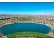 Aerial view of neighborhood lake with seating area on the edge at 1091 E Sunset Rd, Henderson, NV 89011