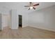 Neutral bedroom features wood-look floors and multiple closets at 1163 Tumbling River Ave, Henderson, NV 89052