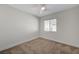 Bright bedroom featuring neutral paint, a window, ceiling fan, and carpeted floors at 1163 Tumbling River Ave, Henderson, NV 89052