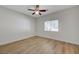 Well-lit bedroom features wood-look floors and a bright window at 1163 Tumbling River Ave, Henderson, NV 89052