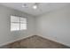 Neutral bedroom with ceiling fan, carpet and a window at 1163 Tumbling River Ave, Henderson, NV 89052