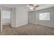 Neutral bedroom with carpet and a window at 1163 Tumbling River Ave, Henderson, NV 89052