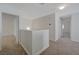 Bright hallway featuring neutral tones and carpeted flooring leading to other rooms at 1163 Tumbling River Ave, Henderson, NV 89052