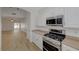 Bright kitchen view features stainless appliances and an open floor plan at 1163 Tumbling River Ave, Henderson, NV 89052