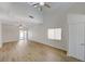 Bright living room featuring vaulted ceilings, modern fan, and sliding doors at 1163 Tumbling River Ave, Henderson, NV 89052