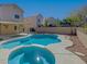 Inviting pool and spa combo complemented by lush landscaping and private backyard setting at 1163 Tumbling River Ave, Henderson, NV 89052