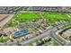 Aerial view of community featuring green spaces, tennis and basketball courts, playground, and walking paths at 12541 Lylan Ridge St, Las Vegas, NV 89138