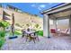 Charming backyard patio area with table and chairs, perfect for outdoor entertaining at 12541 Lylan Ridge St, Las Vegas, NV 89138