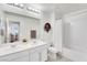 Bright bathroom featuring double sinks, modern fixtures, and a shower over tub with white subway tile at 12541 Lylan Ridge St, Las Vegas, NV 89138