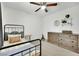 Stylish bedroom featuring a single bed, ceiling fan, and neutral color palette at 12541 Lylan Ridge St, Las Vegas, NV 89138