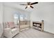 Adorable Bedroom with changing table, soft chair, and neutral color palette at 12541 Lylan Ridge St, Las Vegas, NV 89138