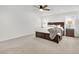 This bedroom boasts neutral colors, plush carpet, and a dark wood bed frame at 12541 Lylan Ridge St, Las Vegas, NV 89138