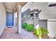 Inviting entryway with a blue door, brick pavers, and lush landscaping at 12541 Lylan Ridge St, Las Vegas, NV 89138