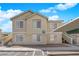 Home exterior showcases an upstairs unit, covered parking, and well-kept landscaping at 1541 Linnbaker Ln # 202, Las Vegas, NV 89110