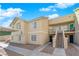 Attractive home exterior with upstairs unit, private balcony, covered parking, and manicured landscaping at 1541 Linnbaker Ln # 202, Las Vegas, NV 89110