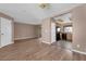 Open-concept living space with wood-look floors that flow into the kitchen at 1541 Linnbaker Ln # 202, Las Vegas, NV 89110