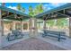 Outdoor picnic area featuring covered tables and ceiling fans, perfect for community gatherings and relaxation at 1541 Linnbaker Ln # 202, Las Vegas, NV 89110