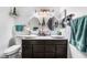 Modern bathroom featuring dual sinks and mirrors with ample lighting at 181 Lido Cir, Henderson, NV 89015