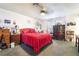 Comfortable bedroom with a ceiling fan, carpeted floors, and natural light at 181 Lido Cir, Henderson, NV 89015