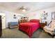 Carpeted bedroom featuring a bed, sitting chair, and closet at 181 Lido Cir, Henderson, NV 89015