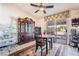 Cozy dining area with a table and chairs, complemented by tile flooring and a large cabinet at 181 Lido Cir, Henderson, NV 89015