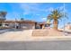 Well-kept single-story residence showcasing a desert landscape, tiled roof, and two-car garage at 181 Lido Cir, Henderson, NV 89015