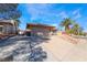 Cozy single-story home featuring a two-car garage, tiled roof, and low-maintenance front yard at 181 Lido Cir, Henderson, NV 89015