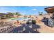 Backyard pool and fire pit with patio seating at 181 Lido Cir, Henderson, NV 89015