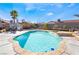 Sparkling swimming pool with a spa, surrounded by palm trees at 181 Lido Cir, Henderson, NV 89015