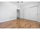 Bedroom showcasing wood-look floors, a closet with sliding doors, and neutral decor at 1830 N Buffalo Dr # 1019, Las Vegas, NV 89128