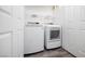 Laundry room featuring a modern washer, dryer, and storage shelves at 1830 N Buffalo Dr # 1019, Las Vegas, NV 89128