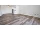 Unfurnished living room with light walls and wood-look flooring at 1830 N Buffalo Dr # 1019, Las Vegas, NV 89128