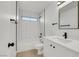 Bathroom with sleek vanity, modern fixtures, and tiled shower-tub at 1905 Joella St, Las Vegas, NV 89108