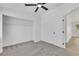 Bedroom with ceiling fan, carpet, and a closet at 1905 Joella St, Las Vegas, NV 89108