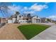 Spacious single-story home showcasing a well-manicured lawn and a two-car gray garage door at 1905 Joella St, Las Vegas, NV 89108