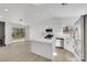 Open-concept kitchen and living room with an island, a fireplace and stainless appliances at 1905 Joella St, Las Vegas, NV 89108