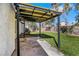 Covered patio area offering a shaded retreat with views of the lovely backyard and landscaping at 1905 Joella St, Las Vegas, NV 89108