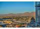 Expansive aerial view showing the city skyline and mountain ranges in the distance, creating a unique backdrop at 200 W Sahara Ave # 1711, Las Vegas, NV 89102