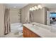 Bathroom with double sinks, bathtub, and shower at 200 W Sahara Ave # 1711, Las Vegas, NV 89102