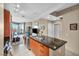 Modern kitchen featuring wood cabinets, stainless steel appliances, and an inviting view to the living room at 200 W Sahara Ave # 1711, Las Vegas, NV 89102