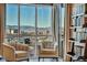 Inviting living area with comfortable seating and expansive windows showcasing the city and mountain views at 200 W Sahara Ave # 1711, Las Vegas, NV 89102