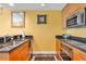 Well-lit kitchen with stainless steel appliances and dark countertops at 2000 N Fashion Show Dr # 5326, Las Vegas, NV 89109