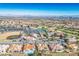 Panoramic aerial view of a community with a golf course, baseball field, and scenic mountain backdrop at 2265 Lauren Dr, Las Vegas, NV 89134