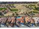 Expansive aerial view of homes situated near a picturesque golf course in a vibrant community at 2265 Lauren Dr, Las Vegas, NV 89134