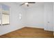 This bedroom features light colored walls, hardwood flooring and a ceiling fan at 2265 Lauren Dr, Las Vegas, NV 89134