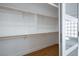 Bright walk-in closet with custom wood shelving and ample storage space at 2265 Lauren Dr, Las Vegas, NV 89134